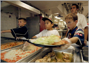 Overnight Encampment Scouts Serve Chow